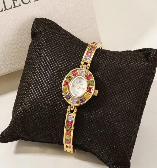 vintage gold and silver gemstone watch